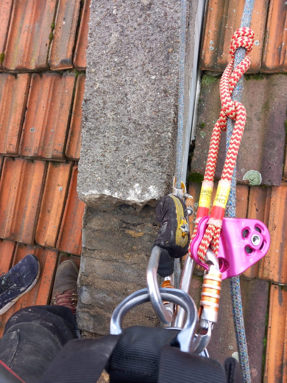 Rigging anchor and pulley set on a roof ridge